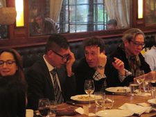 Bertrand Bonello makes a point to Dennis Lim at the uniFrance lunch